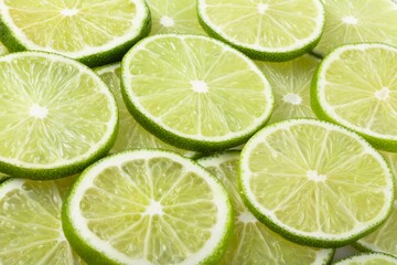 Fototapeta na wymiar Close-Up of Slices of Limes