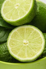 Bowl of Limes with Leaves Close-Up