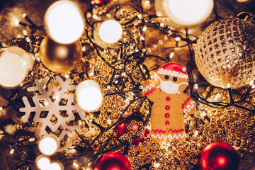 Festive Christmas background with gingerbread men wearing a medical protective mask on their faces....