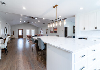 Eye-level , Eat in Kitchen, white, modern, sleek, open floor plan, quartz island, oversized, 