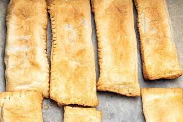 uncooked sweet pastry bun at a cooking tray. homemade cooking concept