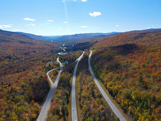 Interstate Highway I-93 across Franconia Notch between Cannon Mountain and Mount Lafayette with fall foliage in Franconia Notch State Park in White Mountain, Lincoln, New Hampshire NH, USA. 