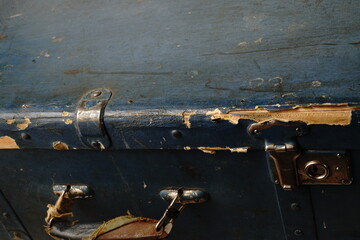 Naklejka premium An old suitcase about 40 years of the 19th century. Dark blue color and protected corners with metal inserts. Two locks. Big.