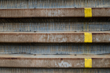 Metal retaining wall with yellow paint