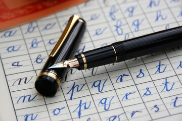 black and golden fountain pen