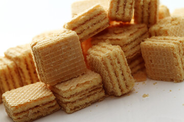 Lemon cream cube wafer on white background