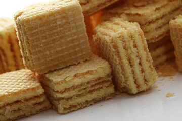 Lemon cream cube wafer on white background