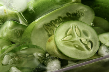 Fototapeta premium Full frame of sliced cucumber in cold water