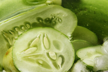 Full frame of sliced cucumber in cold water