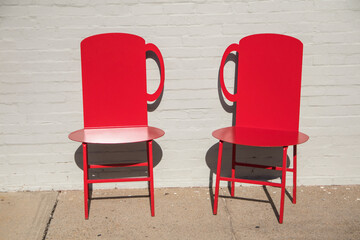 Two red chairs outside