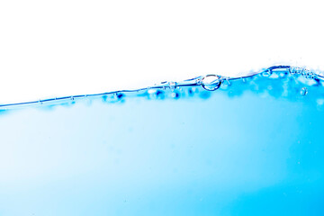 Water wave motion on surface of water and bubbles created by the movement isolated white background.