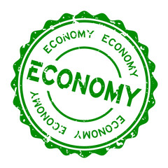 Grunge green economy word round rubber seal stamp on white background
