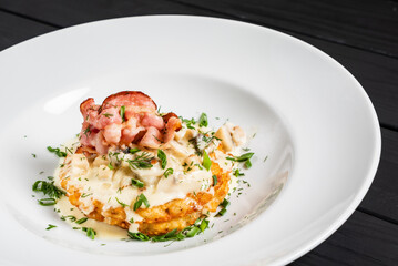 potato pancakes with bacon and sauce
