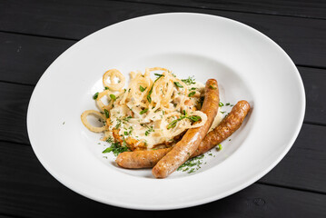 potato pancakes with sausages and fried onion