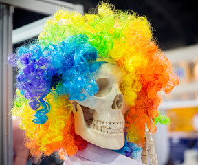 A skull wearing a wig, colorful and funny.