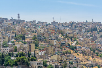 Fototapeta na wymiar Cityscape of Amman with numerous buildings, the capital and most populous city of Jordan, view from Amman Citadel, known in Arabic as Jabal al-Qal'a.