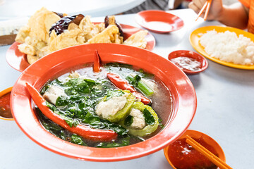 Serving of yong tau fu, Malaysia popular stuffed fish meat in vegetable and tofu.