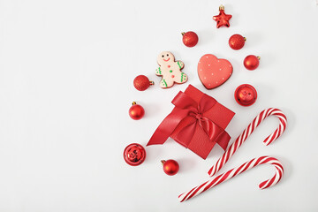 Christmas gift box, lollipops and toys background. Xmas flat lay. Happy New Year and Merry Christmas greeting card. Template, copy space. Winter celebrations, weekends and vacations.
