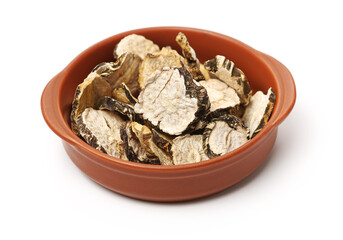 Peruvian ginseng or maca Lepidium meyenii, dried root and pow ，slice on a white background