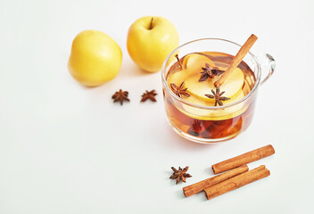 Christmas cup drink background. Tea with cinnamon, apple and star anise. Happy New Year and Merry Christmas greeting card. Cozy morning. Traditional medicine and vitamins. Healthy food