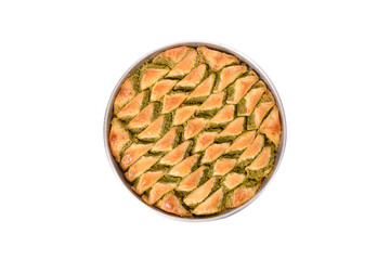 world famous baklava making in Gaziantep, baklava tray on white background. The Turkish name of this dessert variety is şöbiyet