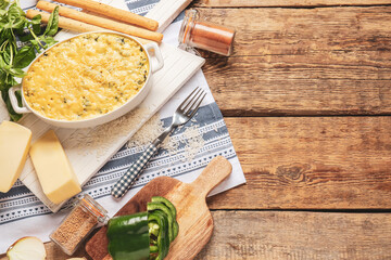 Baking dish with tasty rice casserole on table