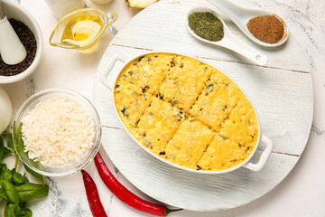Baking dish with tasty rice casserole on table