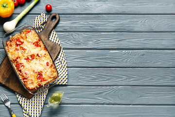 Baking dish with tasty rice casserole on table