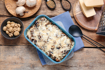 Baking dish with tasty rice casserole on table