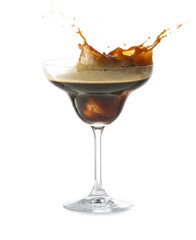 Glass of tasty espresso martini cocktail with splashes on white background