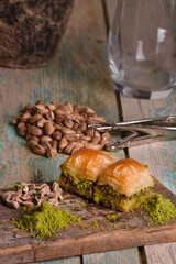 World famous baklava making in Gaziantep. Baklava presentation on wooden board. 