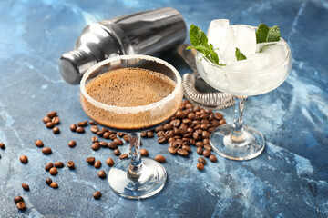 Glass of tasty espresso martini cocktail on color background