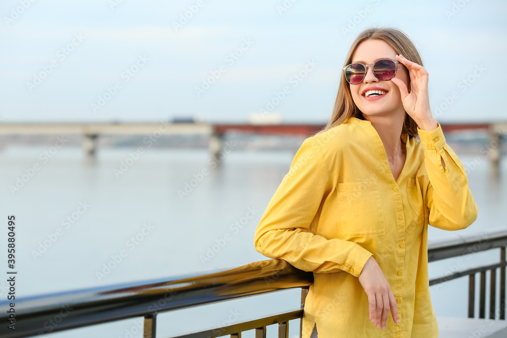 Sticker beautiful woman with stylish sunglasses outdoors