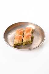 world famous baklava making in Gaziantep. Classic Baklava in metal plate on white background.