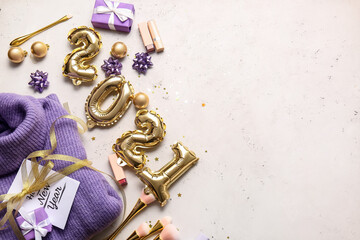 New Year composition with makeup cosmetics and clothes on white background