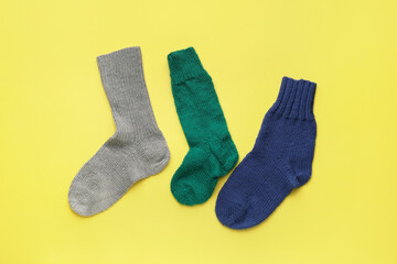Warm socks on color background