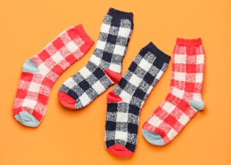 Warm socks on color background