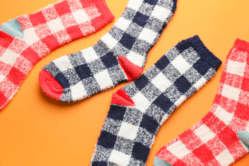 Warm socks on color background