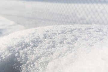 Fototapeta na wymiar Winter scene with closeup of the snow. Cold season weather forecast. Snowy sunny background