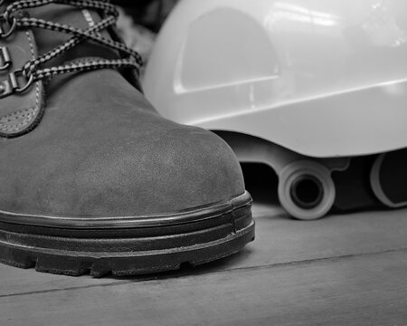 Isolated safety shoe or steel-toe boots used for construction purpose.