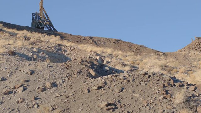 Abandoned Wooden Head Frame of Gold Mine on Ridge Line - Shallow Depth of Field