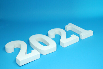 Selective Focus on Happy new year 2021 , 2021 number wooden object on Blue background and copy space - Blue new year celebrate concept 