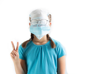 The girl has a lot of medical masks and glasses on her face. The mask with the inscription 