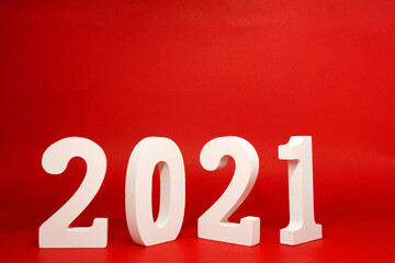 New year 2021 , 2021 number wood object on red background and copy space - red new year celebrate concept                                