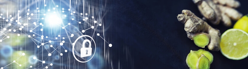 Ginger root whole and sliced. Ginger tea with lemon on the dark background. Fresh ginger root on...