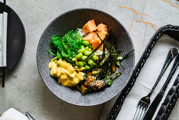 buddha bowl with fish and seaweed