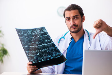 Young male doctor radiologist working in the clinic