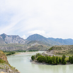 panoramic photo with a view of the Altai Mountains and the bridge over the Katun River to the village of Inegen