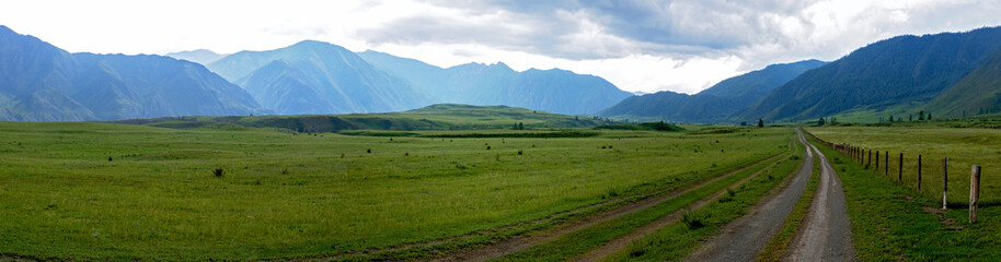 Fototapeta na wymiar panoramic landscape with rural road in Altay