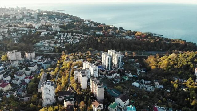 Aerial view of houses with sea view. Residential area at dawn. Sochi city. Black sea.